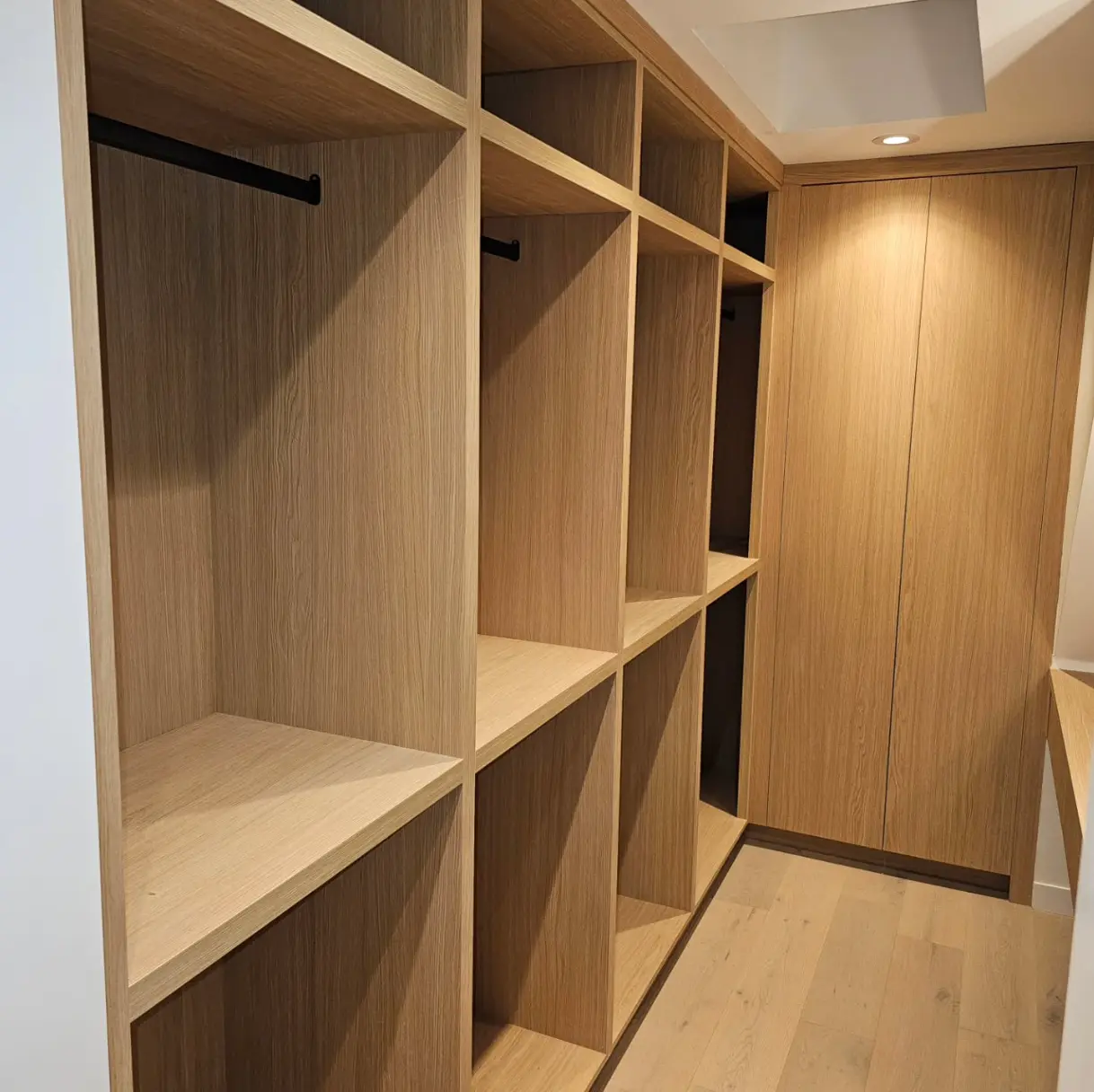 Custom walk-in closet with built-in shelving by Pine Kitchen Design