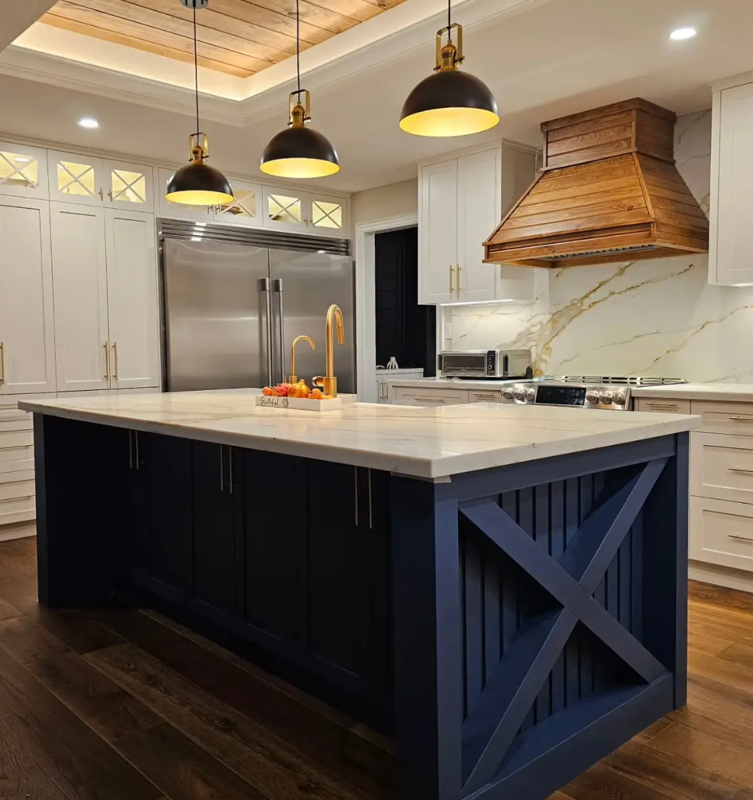 Navy blue island kitchen with wood range hood by Pine Kitchen Design