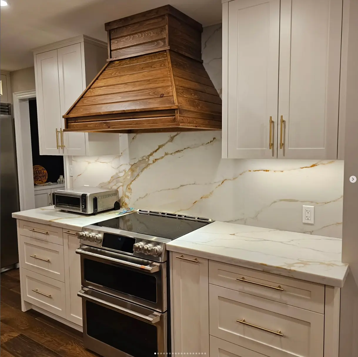 White shaker kitchen with stone countertops by Pine Kitchen Design